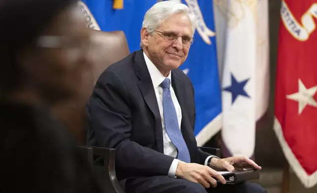 Attorney General Merrick Garland sits during a farewell ceremony at the Department of Justice, Thursday, Jan. 16, 2025, in Washington. (AP Photo/Mark Schiefelbein)