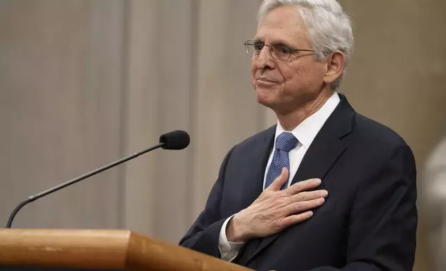 Attorney General Merrick Garland reacts during a farewell ceremony at the Department of Justice, Thursday, Jan. 16, 2025, in Washington. (AP Photo/Mark Schiefelbein)