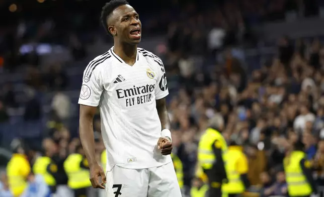 Real Madrid's Vinicius Junior celebrates after scoring his side's 2nd goal against Celta de Vigo during a Copa del Rey round of 16 soccer match at the Santiago Bernabeu stadium in Madrid, Spain, Thursday, Jan. 16, 2025. (AP Photo/Pablo Garcia)