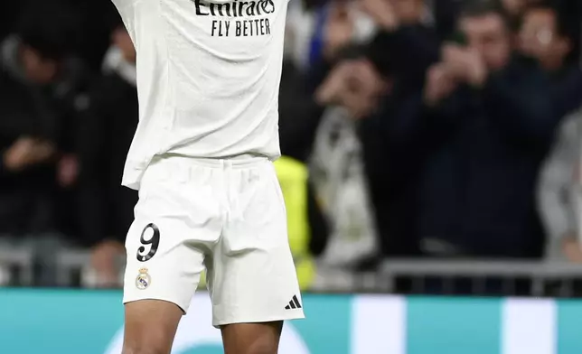 Real Madrid's Kylian Mbappe celebrates after scoring the opening goal against Celta de Vigo during a Copa del Rey round of 16 soccer match at the Santiago Bernabeu stadium in Madrid, Spain, Thursday, Jan. 16, 2025. (AP Photo/Pablo Garcia)