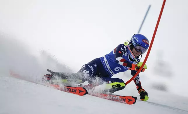 United States' Mikaela Shiffrin speeds down the course during the first run of a women's World Cup slalom, in Courchevel, France, Thursday Jan. 30, 2025. (AP Photo/Gabriele Facciotti)