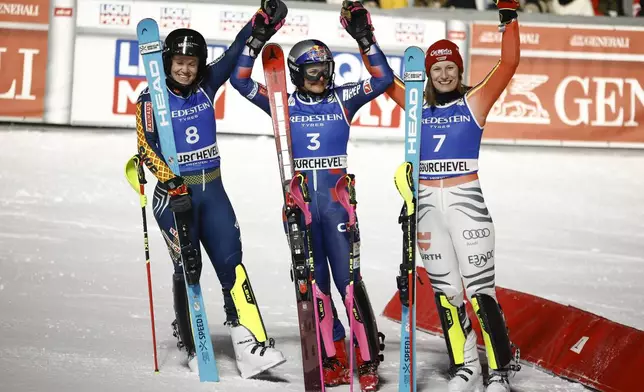 Croatia's Zrinka Ljutic, center, winner of a a women's World Cup slalom, poses with second placed Sweden's Sara Hector, left, and third placed Germany's Lena Duerr, in Courchevel, France, Thursday Jan. 30, 2025. (AP Photo/Gabriele Facciotti)
