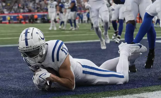 Indianapolis Colts wide receiver Michael Pittman Jr. (11) makes a touchdown catch against the New York Giants in the second half of an NFL football game Sunday, Dec. 29, 2024, in East Rutherford, N.J. (AP Photo/Seth Wenig)