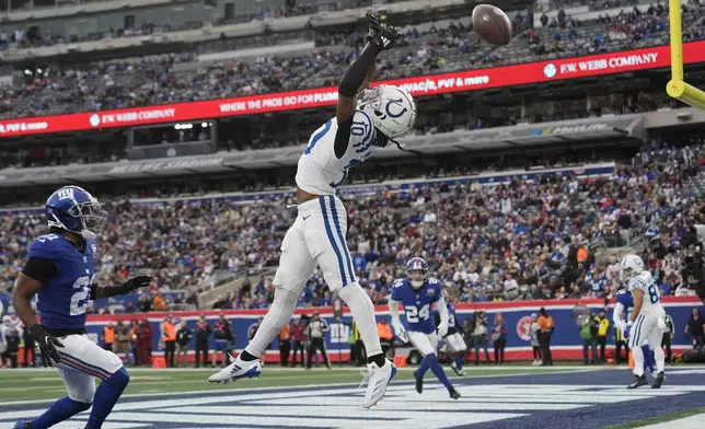 Indianapolis Colts wide receiver Adonai Mitchell (10) misses a pass in the end zone in the second half of an NFL football game against the New York Giants Sunday, Dec. 29, 2024, in East Rutherford, N.J. (AP Photo/Seth Wenig)