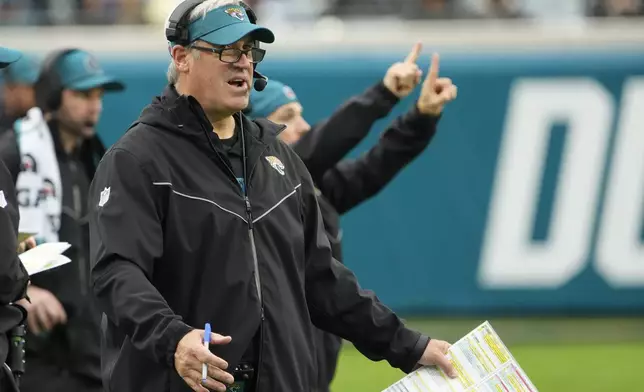 Jacksonville Jaguars head coach Doug Pederson yells to his players during the second half of an NFL football game against the Tennessee Titans, Sunday, Dec. 29, 2024, in Jacksonville, Fla. (AP Photo/John Raoux)