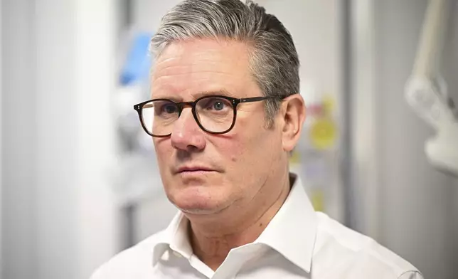 Britain's Prime Minister Keir Starmer visits a healthcare provider to deliver remarks on reducing NHS wait times, in Surrey, England, Monday, Jan. 6, 2025, (Leon Neal/Pool Photo via AP)