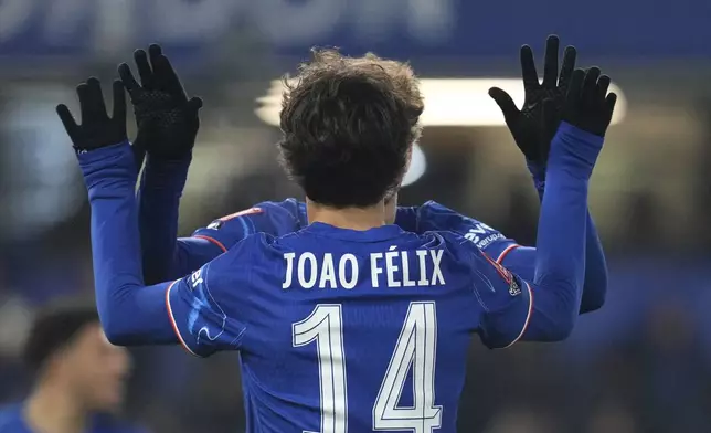 Chelsea's Joao Felix celebrates after scoring his side's fourth goal during the English FA Cup soccer match between Chelsea and Morecambe at Stamford Bridge stadium in London, Saturday, Jan. 11, 2025. (AP Photo/ Kin Cheung)