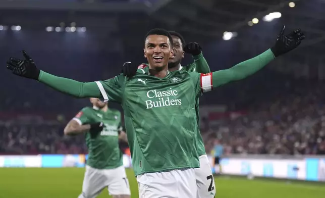 Plymouth Argyle's Morgan Whittaker celebrates scoring his side's first goal of the game, during the English FA Cup third round soccer match between Brentford and Plymouth Argyle, at the Gtech Community Stadium, in London, Saturday, Jan. 11, 2025. ( John Walton/PA via AP)
