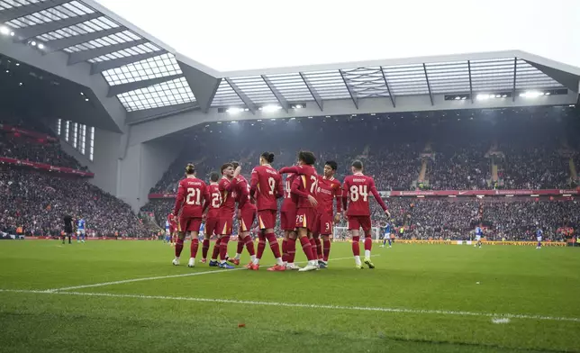 Liverpool's Jayden Danns, third right, celebrates with teammates after scoring his side's third goal during the FA Cup soccer match between Liverpool and Accrington Stanley at the Anfield stadium in Liverpool, England, Saturday, Jan. 11, 2025. (AP Photo/Jon Super)