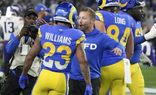Los Angeles Rams head coach Sean McVay talks with running back Kyren Williams (23) before an NFL wild card playoff football game against the Minnesota Vikings, Monday, Jan. 13, 2025, in Glendale, Ariz. (AP Photo/Rick Scuteri)