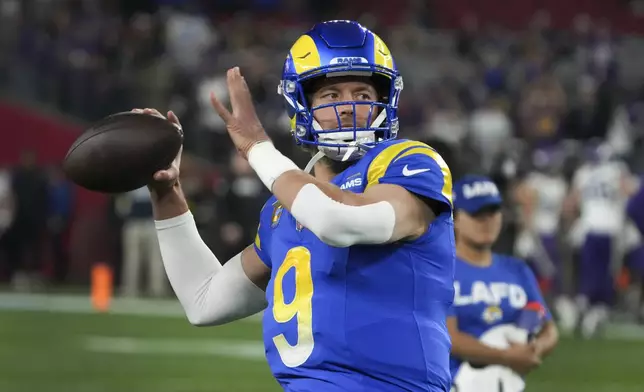 Los Angeles Rams quarterback Matthew Stafford (9) throws before an NFL wild card playoff football game against the Minnesota Vikings, Monday, Jan. 13, 2025, in Glendale, Ariz. (AP Photo/Rick Scuteri)