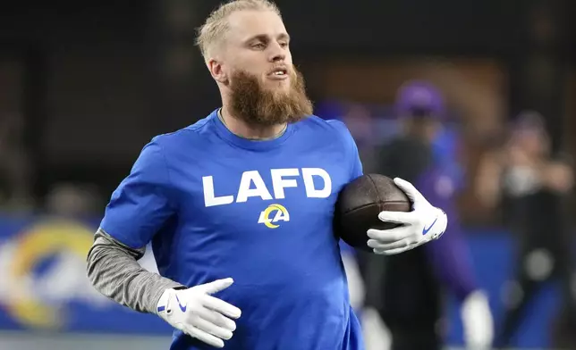 Los Angeles Rams wide receiver Cooper Kupp catches a pass before an NFL wild card playoff football game against the Minnesota Vikings, Monday, Jan. 13, 2025, in Glendale, Ariz. (AP Photo/Rick Scuteri)