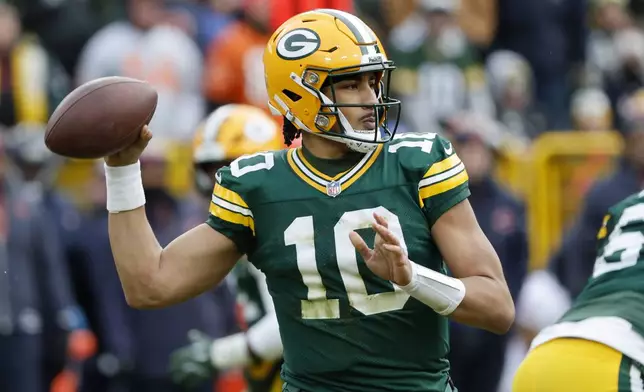 Green Bay Packers quarterback Jordan Love (10) passes against the Chicago Bears during the first half of an NFL football game, Sunday, Jan. 5, 2025, in Green Bay, Wis. (AP Photo/Mike Roemer)