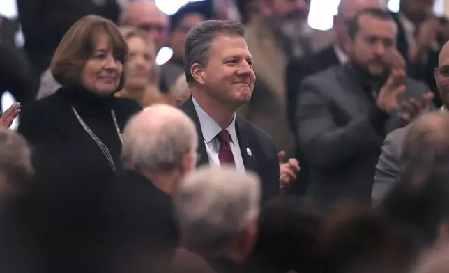 Former N.H. Gov. Chris Sununu is recognized by Republican Kelly Ayotte during her inauguration at the State House, Thursday, Jan. 9, 2025, in Concord, N.H. (AP Photo/Charles Krupa)