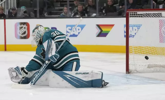 San Jose Sharks goaltender Yaroslav Askarov (30) cannot stop a goal scored by Minnesota Wild left wing Matt Boldy during the second period of an NHL hockey game in San Jose, Calif., Saturday, Jan. 11, 2025. (AP Photo/Jeff Chiu)
