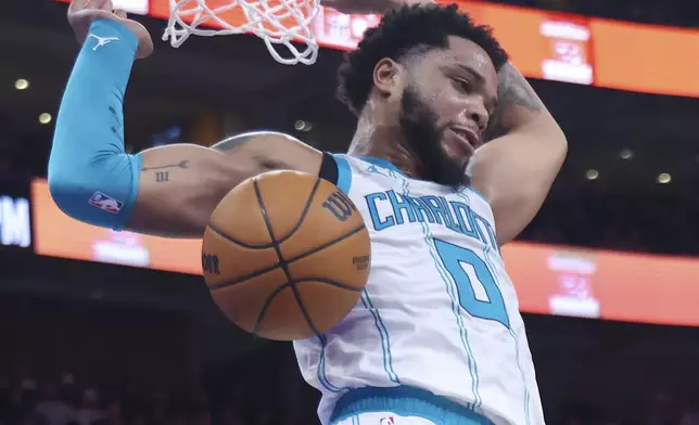 Charlotte Hornets forward Miles Bridges dunks the ball against the Utah Jazz during the second quarter of an NBA basketball game, Wednesday, Jan. 15, 2025, in Salt Lake City. (AP Photo/Rob Gray)