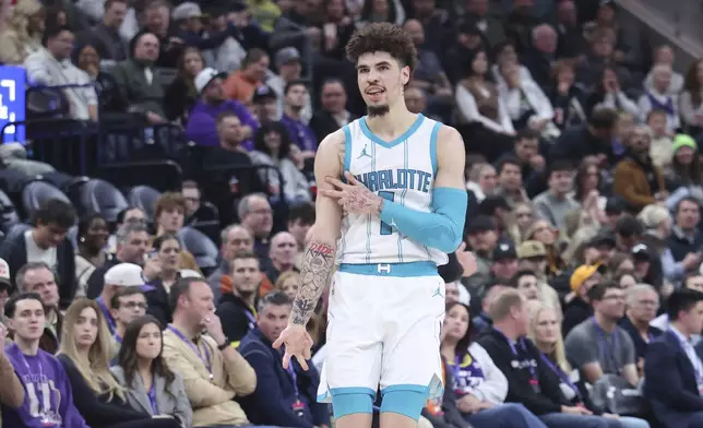 Charlotte Hornets guard LaMelo Ball reacts to a shot against the Utah Jazz during the second quarter of an NBA basketball game, Wednesday, Jan. 15, 2025, in Salt Lake City. (AP Photo/Rob Gray)