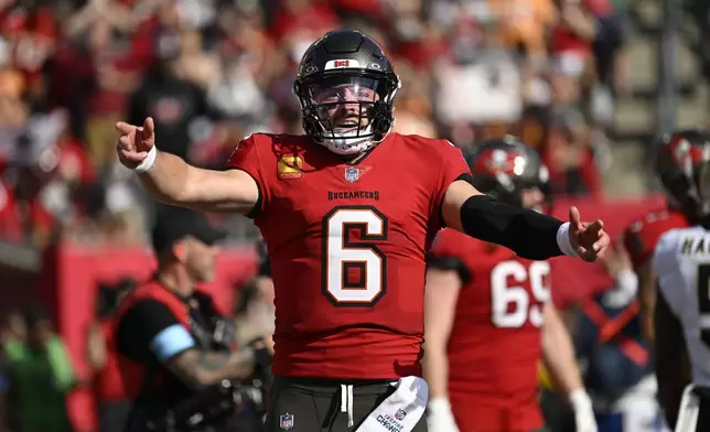 Tampa Bay Buccaneers quarterback Baker Mayfield (6) celebrates his touchdown pass during the second half of an NFL football game against the New Orleans Saints Sunday, Jan. 5, 2025, in Tampa, Fla. (AP Photo/Jason Behnken)