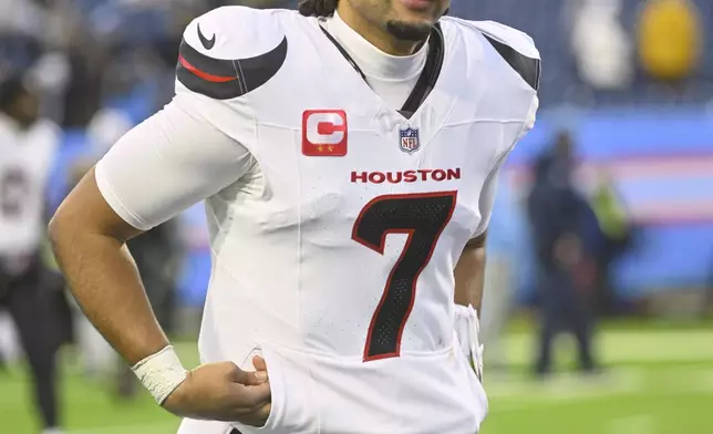 Houston Texans quarterback C.J. Stroud runs off the field after an NFL football game against the Tennessee Titans Sunday, Jan. 5, 2025, in Nashville, Tenn. The Texans won 23-14. (AP Photo/John Amis)