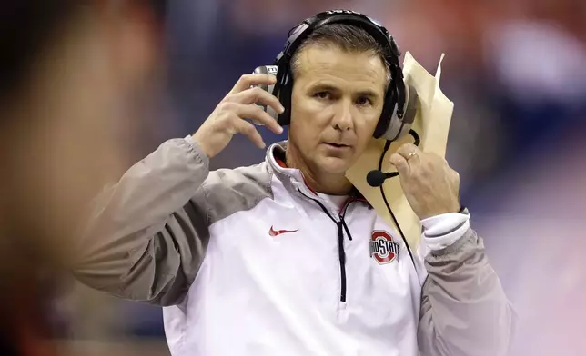 FILE- Ohio State head coach Urban Meyer watches from the sidelines during the second half of the Big Ten Conference championship NCAA college football game against Wisconsin Saturday, Dec. 6, 2014, in Indianapolis. (AP Photo/Darron Cummings, File)