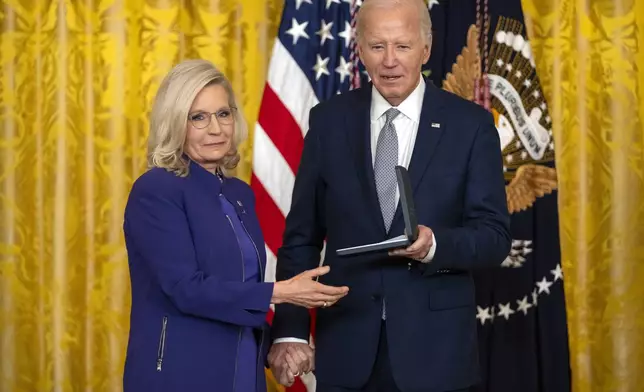 President Joe Biden awards the Presidential Citizens Medal to former Rep. Liz Cheney, R-Wyo., during a ceremony in the East Room at the White House, Thursday, Jan. 2, 2025, in Washington. (AP Photo/Mark Schiefelbein)