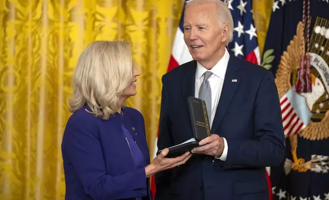 President Joe Biden awards the Presidential Citizens Medal to former Rep. Liz Cheney, R-Wyo., during a ceremony in the East Room at the White House, Thursday, Jan. 2, 2025, in Washington. (AP Photo/Mark Schiefelbein)