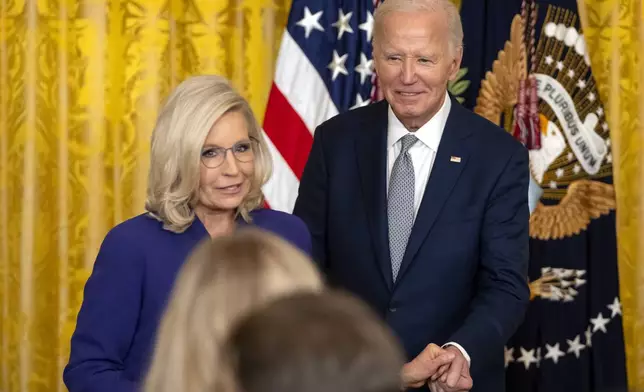 President Joe Biden awards the Presidential Citizens Medal to former Rep. Liz Cheney, R-Wyo., during a ceremony in the East Room at the White House, Thursday, Jan. 2, 2025, in Washington. (AP Photo/Mark Schiefelbein)