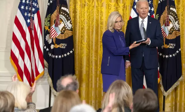 President Joe Biden awards the Presidential Citizens Medal to former Rep. Liz Cheney, R-Wyo., during a ceremony in the East Room at the White House, Thursday, Jan. 2, 2025, in Washington. (AP Photo/Mark Schiefelbein)