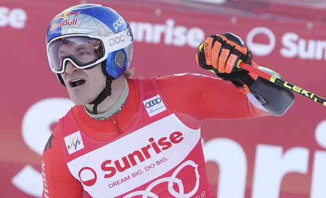 Switzerland's Marco Odermatt reacts after completing an alpine ski, men's World Cup giant slalom race, in Adelboden, Switzerland, Sunday, Jan. 12, 2025. (AP Photo/Giovanni Zenoni)