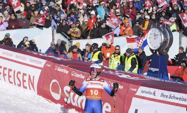 Italy's Luca De Aliprandini reacts after completing an alpine ski, men's World Cup giant slalom race, in Adelboden, Switzerland, Sunday, Jan. 12, 2025. (AP Photo/Giovanni Zenoni)