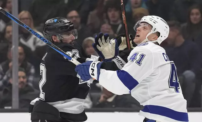 Los Angeles Kings left wing Kevin Fiala, left, and Tampa Bay Lightning right wing Mitchell Chaffee scuffle during the first period of an NHL hockey game, Saturday, Jan. 4, 2025, in Los Angeles. (AP Photo/Mark J. Terrill)