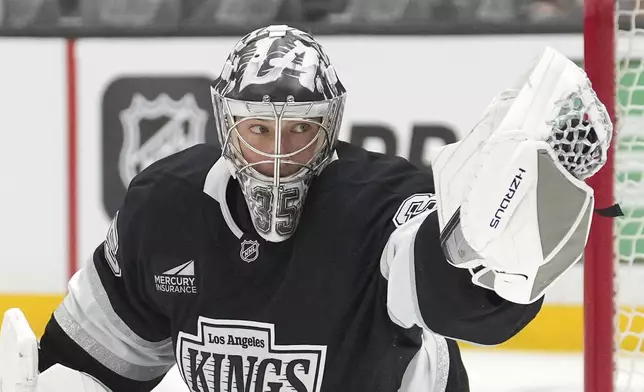 Los Angeles Kings goaltender Darcy Kuemper makes a glove save during the first period of an NHL hockey game against the Tampa Bay Lightning, Saturday, Jan. 4, 2025, in Los Angeles. (AP Photo/Mark J. Terrill)