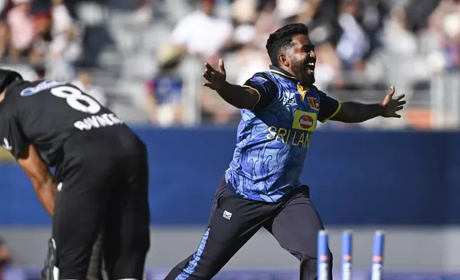 Sri Lanka's Asitha Fernando celebrates the wicket of Rachin Ravindra during the 3rd one day international cricket match against New Zealand at Eden Park in Auckland, New Zealand. Saturday, Jan. 11, 2025. (Andrew Cornaga/Photosport via AP)