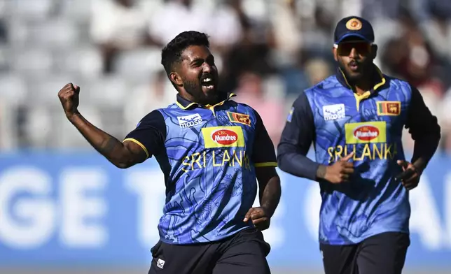 Sri Lanka's Asitha Fernando celebrates the wicket of Rachin Ravindra during the 3rd one day international cricket match against New Zealand at Eden Park in Auckland, New Zealand, Saturday, Jan. 11, 2025. (Andrew Cornaga/Photosport via AP)