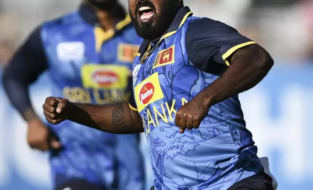 Sri Lanka's Asitha Fernando celebrates the wicket of New Zealand's Glenn Phillips during the 3rd one day international cricket match at Eden Park in Auckland, New Zealand, Saturday, Jan. 11, 2025. (Andrew Cornaga/Photosport via AP)