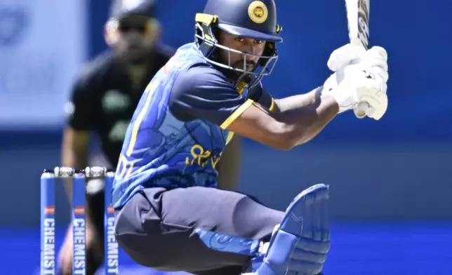 Sri Lanka's Kamindu Mendis ducks a bouncer during the 3rd one day international cricket match between New Zealand and Sri Lanka at Eden Park in Auckland, New Zealand, Saturday, Jan. 11, 2025. (Andrew Cornaga/Photosport via AP)