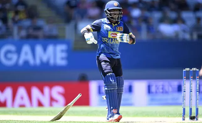 Sri Lanka's Pathum Nissanka gets injured during the 3rd one day international cricket match between New Zealand and Sri Lanka at Eden Park in Auckland, New Zealand, Saturday, Jan. 11, 2025. (Andrew Cornaga/Photosport via AP)