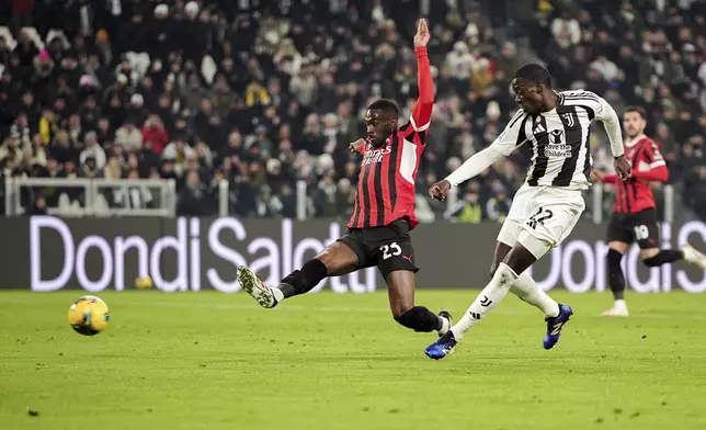 Juventus' Timothy Weah, right, scores during the Italian Serie A soccer match between Juventus and AC Milan at the Allianz Stadium in Turin, Italy, Saturday, Jan. 18, 2025. (Marco Alpozzi/LaPresse via AP)