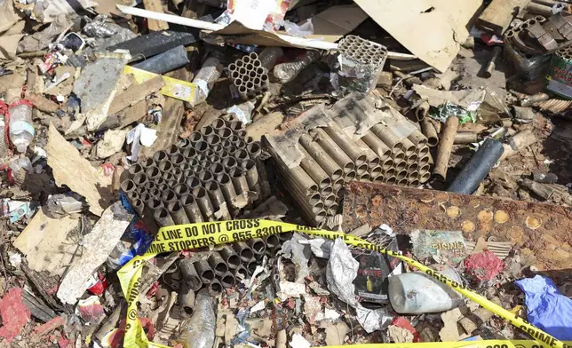 Fireworks debris is seen outside the home where a New Year's Eve fireworks explosion killed and injured people, Wednesday, Jan. 1, 2025, in Honolulu. (AP Photo/Marco Garcia)