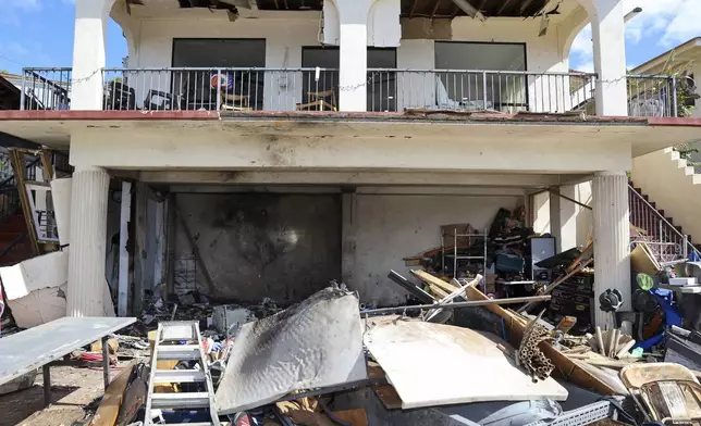 A view of the home where a New Year's Eve fireworks explosion killed and injured people, Wednesday, Jan. 1, 2025, in Honolulu. (AP Photo/Marco Garcia)