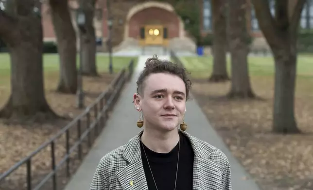 Nick Koenig, a University of Idaho doctoral student who teaches in climate change and sociology, poses for a photo on Thursday, Dec. 12, 2024, on campus in Moscow, Idaho. (AP Photo/Ted S. Warren)