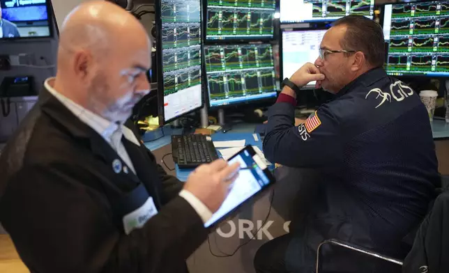 Traders work on the floor at the New York Stock Exchange in New York's Financial District Thursday, Jan. 2, 2025. (AP Photo/Seth Wenig)