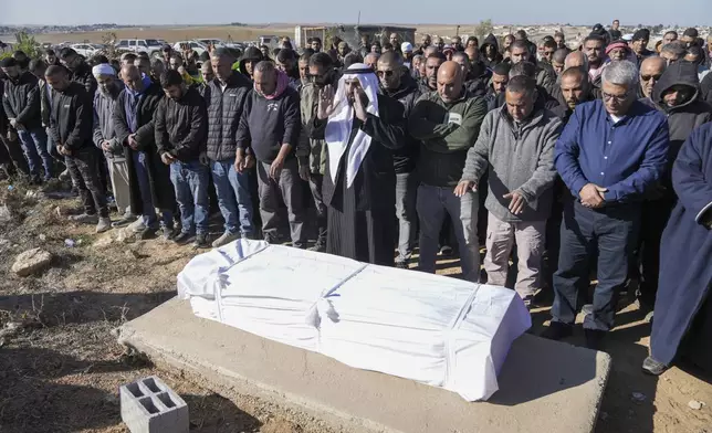 Members of the Bedouin community, part of Israel's Palestinian minority who have Israeli citizenship, attend the funeral of Yosef Al Zaydani in Rahat, southern Israel, Thursday, Jan. 9, 2025 after the Israeli military said his body of was recovered in an underground tunnel in southern Gaza Strip. (AP Photo/Mahmoud Illean)