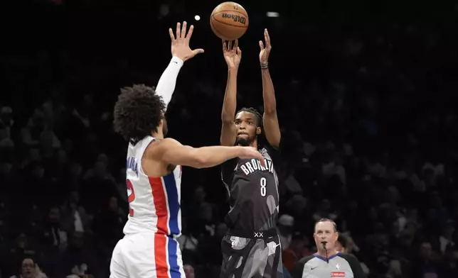 Brooklyn Nets' De'Anthony Melton (8) shoots over Detroit Pistons' Cade Cunningham (2) during the first half of an NBA basketball game, Wednesday, Jan. 8, 2025, in New York. (AP Photo/Frank Franklin II)