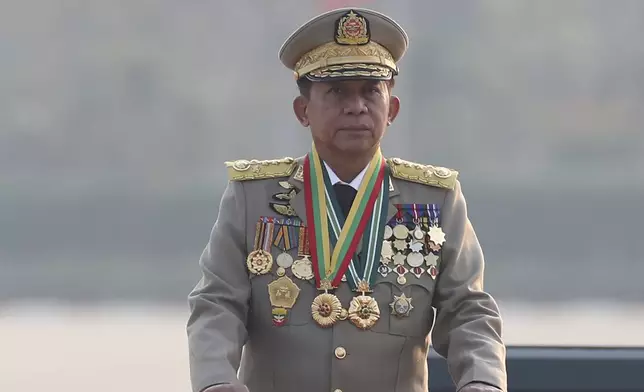 FILE - Myanmar military leader Senior Gen. Min Aung Hlaing, head of the military council, inspects officers during a parade to commemorate Myanmar's 78th Armed Forces Day in Naypyitaw, Myanmar, on March 27, 2023. (AP Photo/Aung Shine Oo)