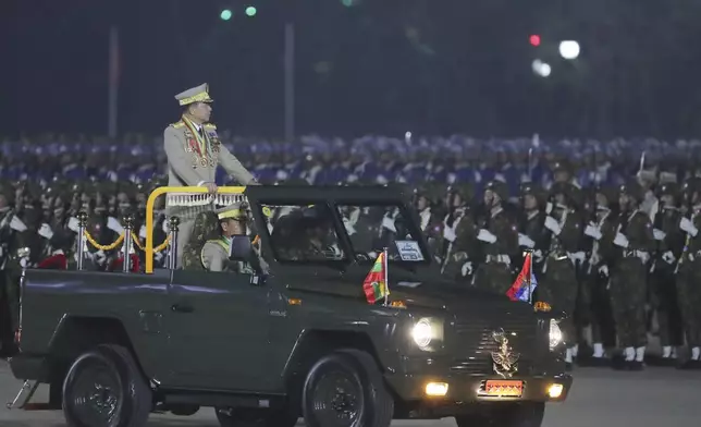 FILE - Myanmar military leader Senior Gen. Min Aung Hlaing, head of the military council, inspects officers during a parade to commemorate Myanmar's 79th Armed Forces Day, in Naypyitaw, Myanmar, on March 27, 2024. (AP Photo/Aung Shine Oo)