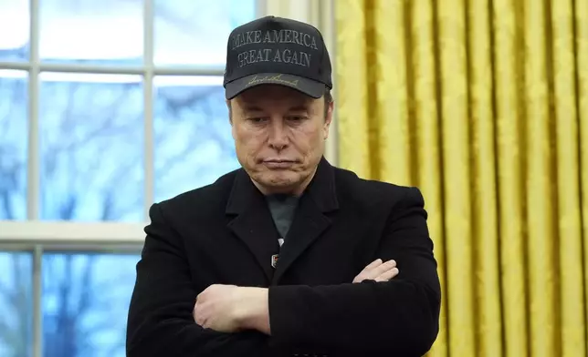 Elon Musk listens as President Donald Trump speaks with reporters in the Oval Office at the White House, Tuesday, Feb. 11, 2025, in Washington. (Photo/Alex Brandon)
