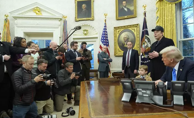 Elon Musk speaks during an event in the Oval Office as President Donald Trump and Musk's son X Æ A-Xii, listen at the White House, Tuesday, Feb. 11, 2025, in Washington. (Photo/Alex Brandon)