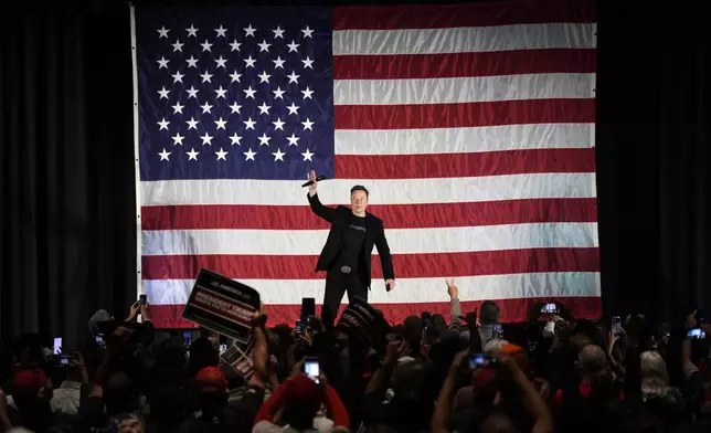 FILE - Elon Musk speaks as part of a campaign town hall in support of Republican presidential nominee former President Donald Trump in Folsom, Pa., Thursday, Oct. 17, 2024. (AP Photo/Matt Rourke, File)