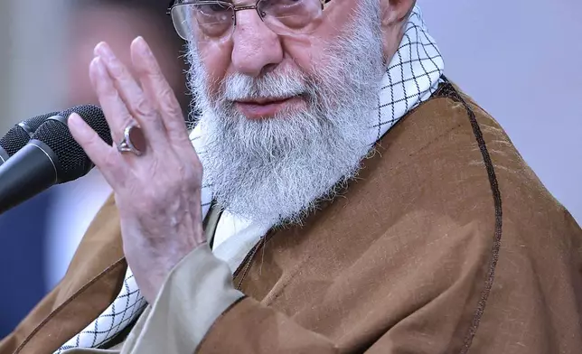 In this photo released by an official website of the office of the Iranian supreme leader, Supreme Leader Ayatollah Ali Khamenei gestures in a meeting with a group of air force officers in Tehran, Iran, Friday, Feb. 7, 2025. (Office of the Iranian Supreme Leader via AP)